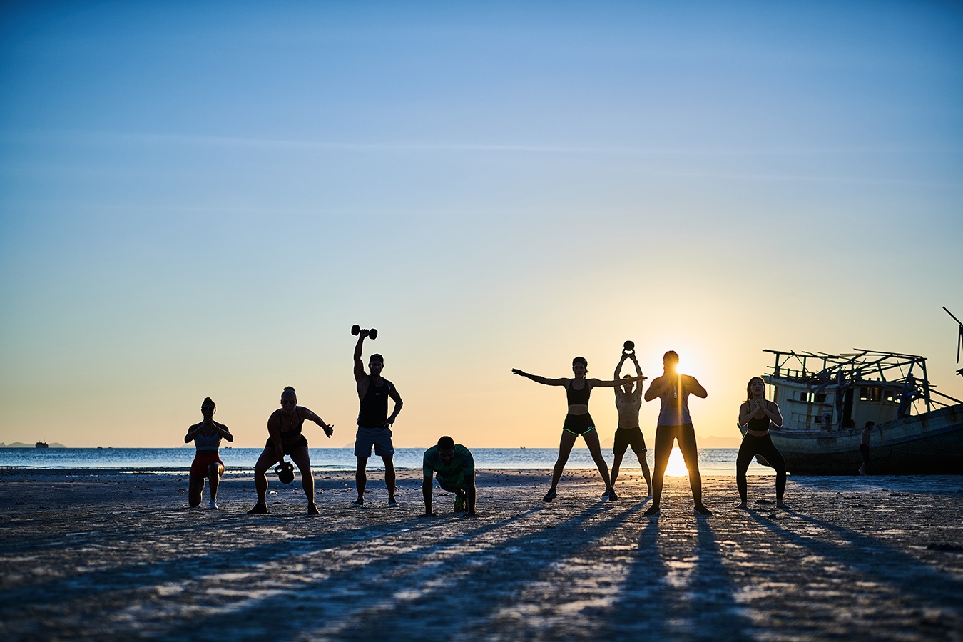 Group training on the beach at sunset in Koh Samui